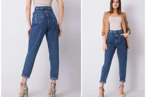 Kobieta w jeansach mom fit, które podkreślają talię i luźno opadają na nogi. To styl, który pokochały kobiety.