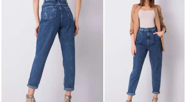 Kobieta w jeansach mom fit, które podkreślają talię i luźno opadają na nogi. To styl, który pokochały kobiety.